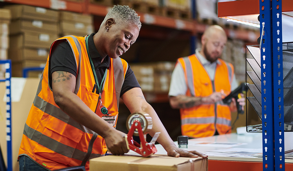 Warehouse Pickers Taping Up Parcels
