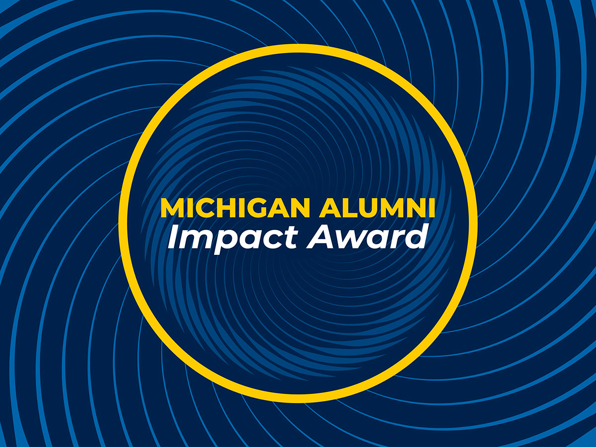Michigan Alumni Impact Award banner with bold maize and white text on a blue, circular-patterned background.