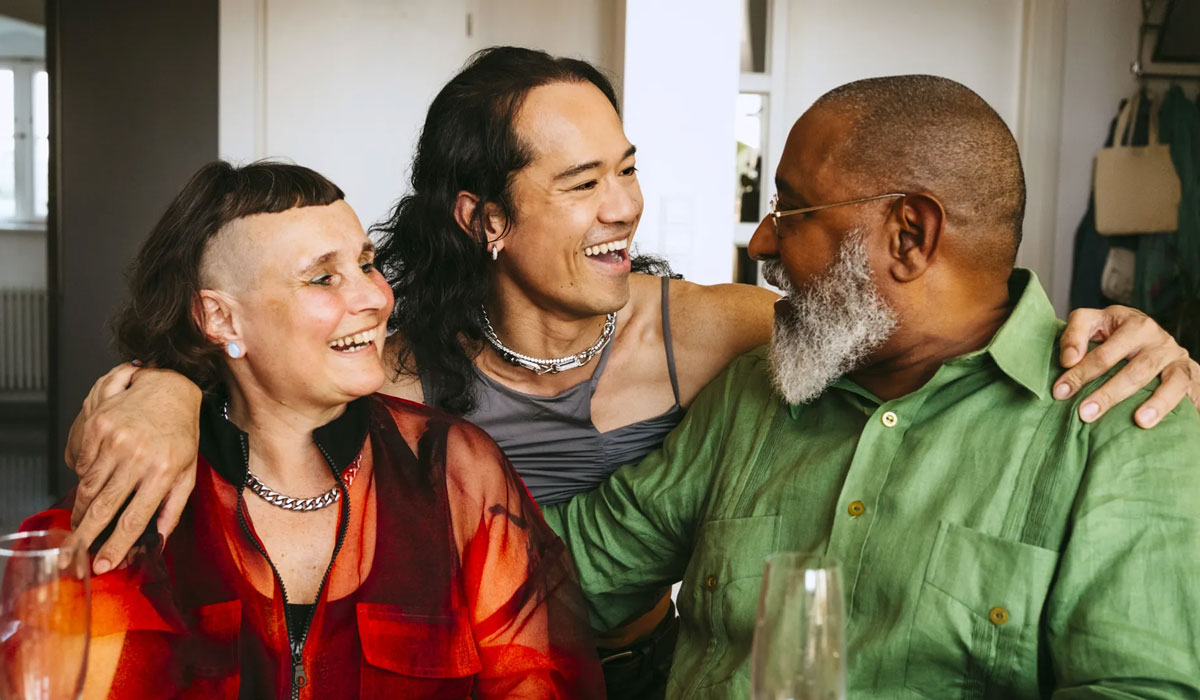 Older Man With Arms Around LGBTQ Friends
