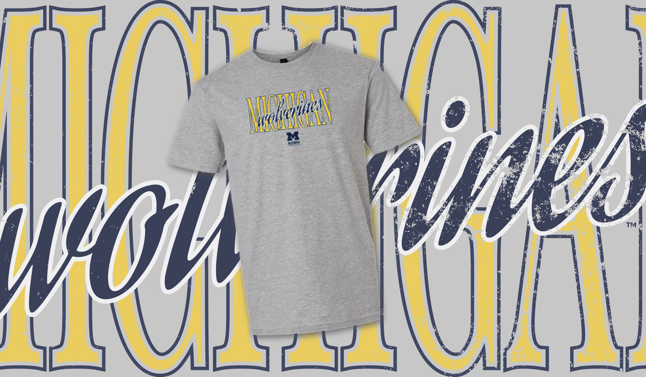 Gray Michigan Wolverines T-shirt displayed on a background with large maize and blue Michigan Wolverines text.