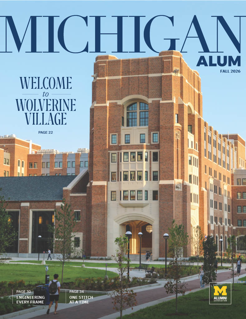 Michigan Alum magazine cover featuring a brick campus building, people walking on a path, and maize and blue branding.