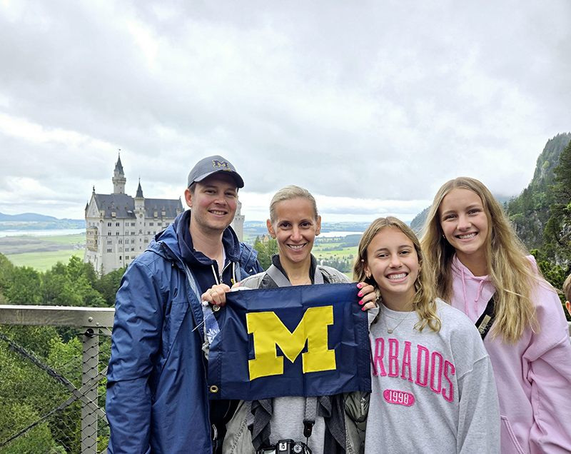 Greg, ’03, and Karen Aicher, ’03, MSN’24, and their daughters took a two-week vacation across Italy and Germany following Karen’s attainment of her master’s degree. Among the sites visited, the family flew the U-M flag at Germany’s Neuschwanstein Castle.