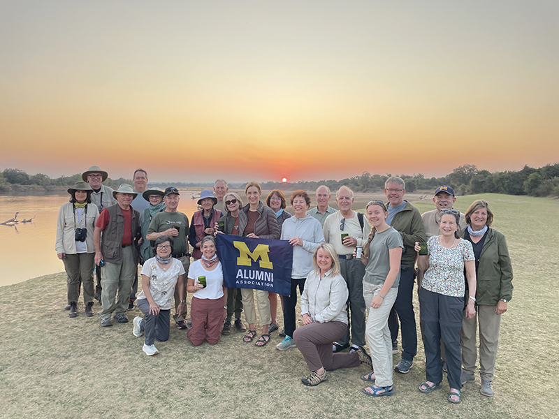 U-M vice president for development Tom Baird, ’83 (fourth from the right), hosted a Michigan Alumni Travel trip across Africa, including an unforgettable experience at the South Luangwa National Park in Zambia.