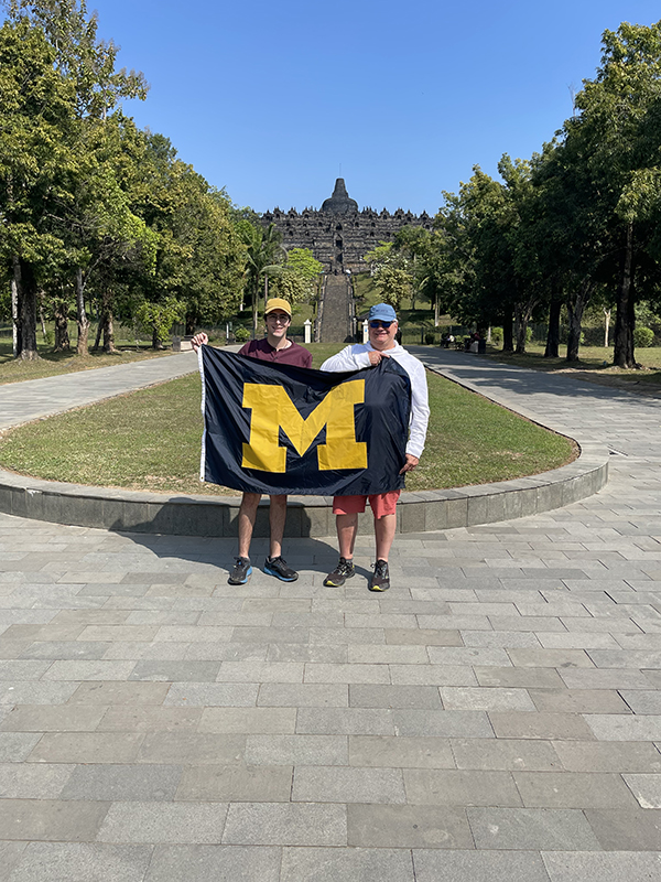 Orlando Cabrera, ’84, and second-generation Wolverine Stefan Cabrera give a hearty “Menjadi biru!” (Go Blue!) from the Temple of Borobudur in Java, Indonesia, during a recent trip. Stefan is researching vaccine hesitancy in Indonesia as part of his master’s degree. Orlando practices affordable housing law in Washington, D.C.