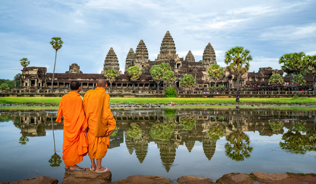 Asian,Monks,Stand,And,Look,To,Angkor,Wat,In,Siem