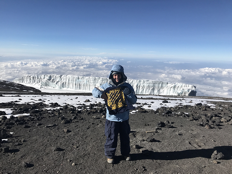 Chandra Luczak, ’00, conquers Mt. Kilimanjaro and shows her Michigan pride with Climb2Cure benefiting the Leukemia & Lymphoma Society.