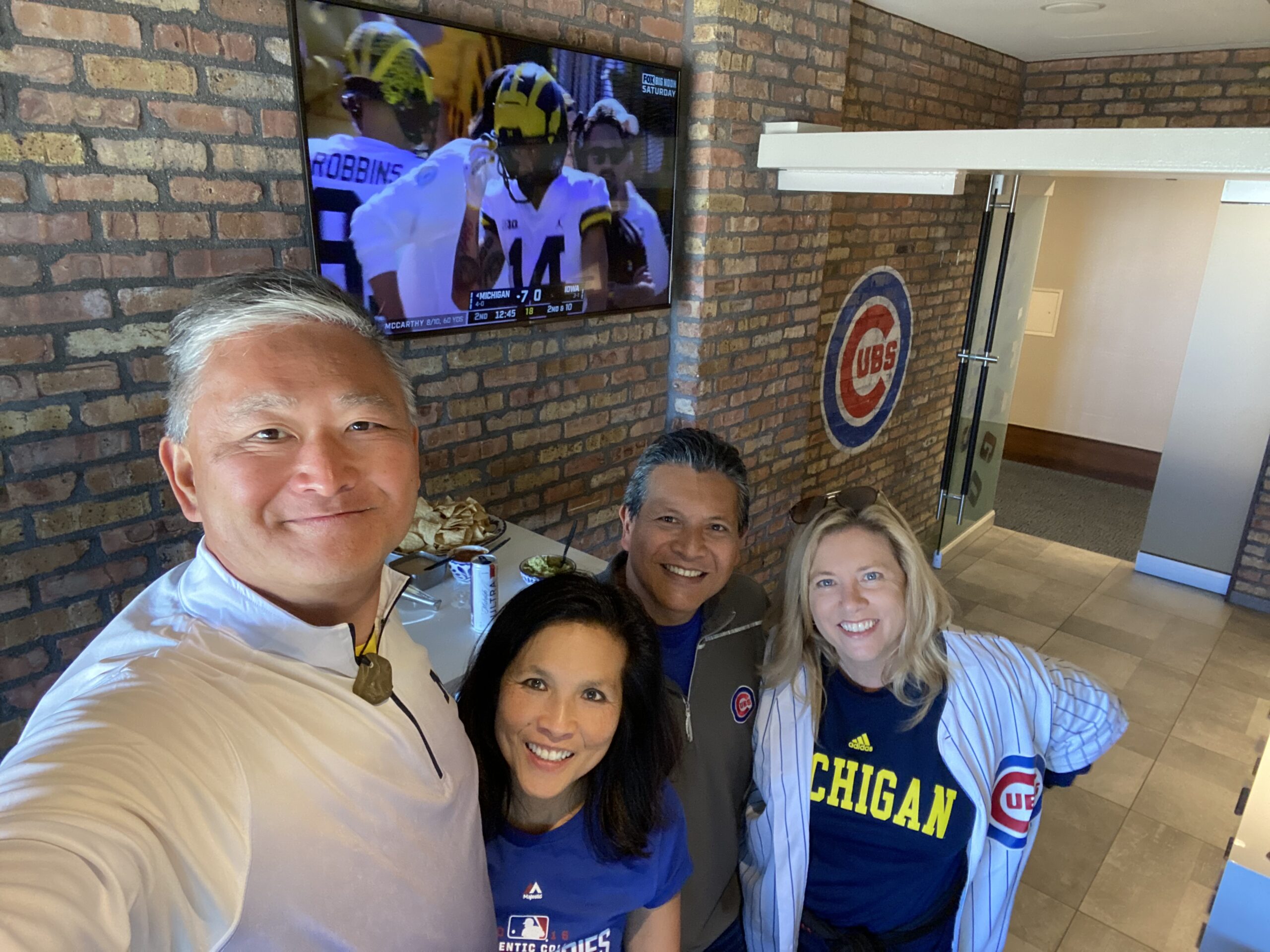 Hamilton Chang, ’89, and others supported Wolverine football while also enjoying a day of baseball at Wrigley Field in Chicago.