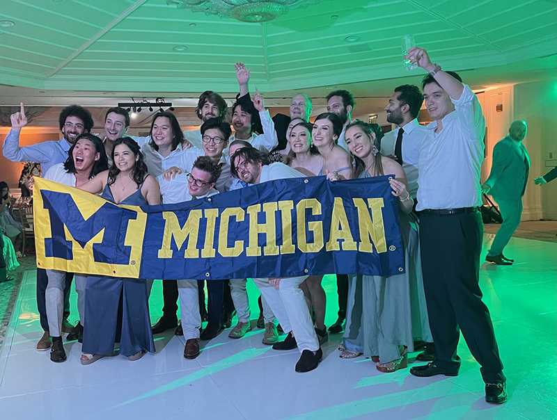 On May 14, newlyweds Jessica Peterson, ’14 (front row, fourth from the right) and John Collins, ’15 (bent down in front of Jessica) celebrated with other alums at Shutters at the Beach in Santa Monica, Calif. Jessica and John met as sophomores at U-M.