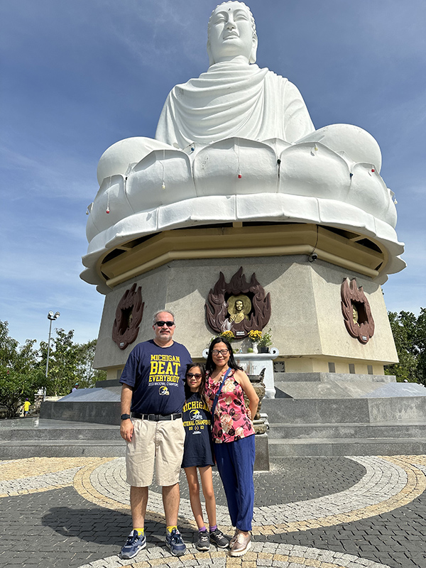 In August, the Conelly family of Chris, ’93, future Wolverine Mai-Ly, and Hanh Bui, ’11, MS’24, took a trip to Vietnam, where they saw the Buddha of Long Son Temple.