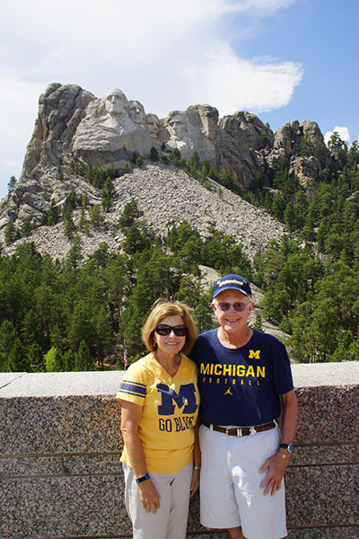 Terry A. Cromwell, MDRES’73, and his wife, Jan, stood in the shadows of four Presidents at Mount Rushmore in South Dakota.