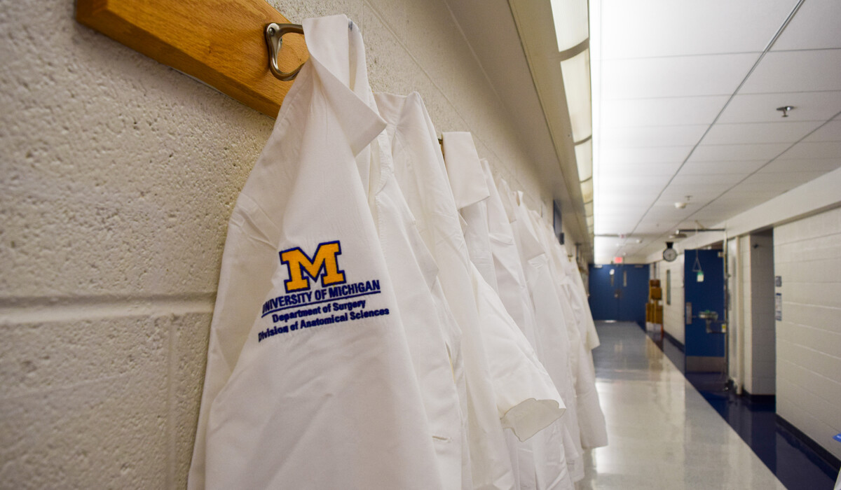 Lab coats are hung up in the Anatomy Lab at the University of Michigan.
