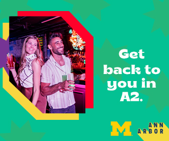 Advertisement for Destination Ann Arbor. Includes a photo of two smiling people and text that says, "Get back to you in A2." A Block M and logo for Destination Ann Arbor are also present.