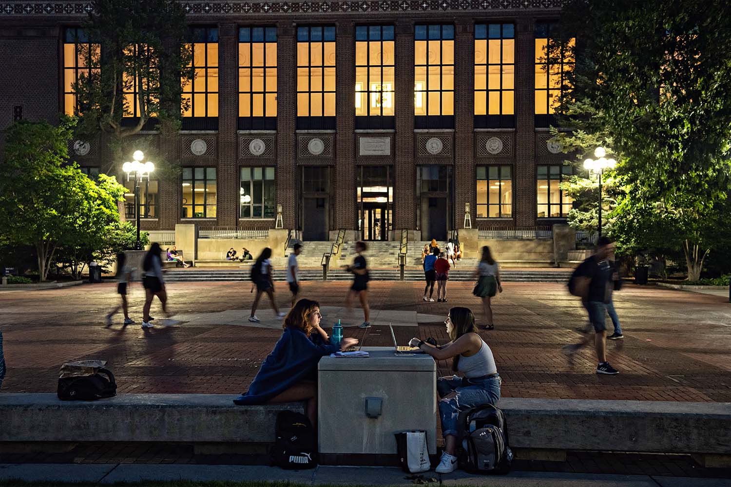 Students on the diag at night