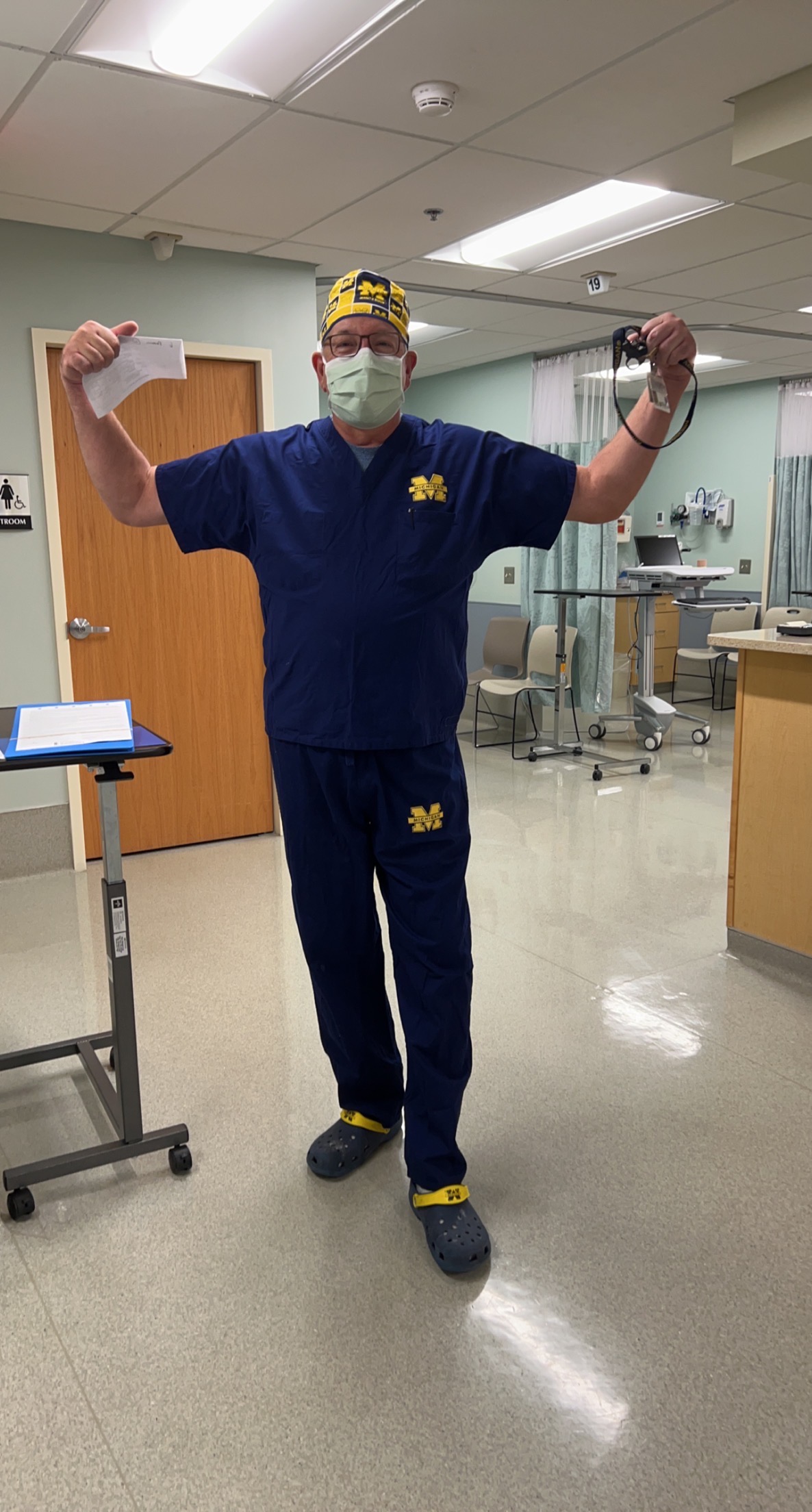 A “Michigan Man” celebrates in the heart of Buckeye country after the 2022 U-M vs. OSU football game. John W. Dietrich, ’78, MD’83, is an orthopedic hand surgeon practicing in Akron, Ohio. In John’s hand is the Michigan lanyard he has worn for the last 20-plus years.