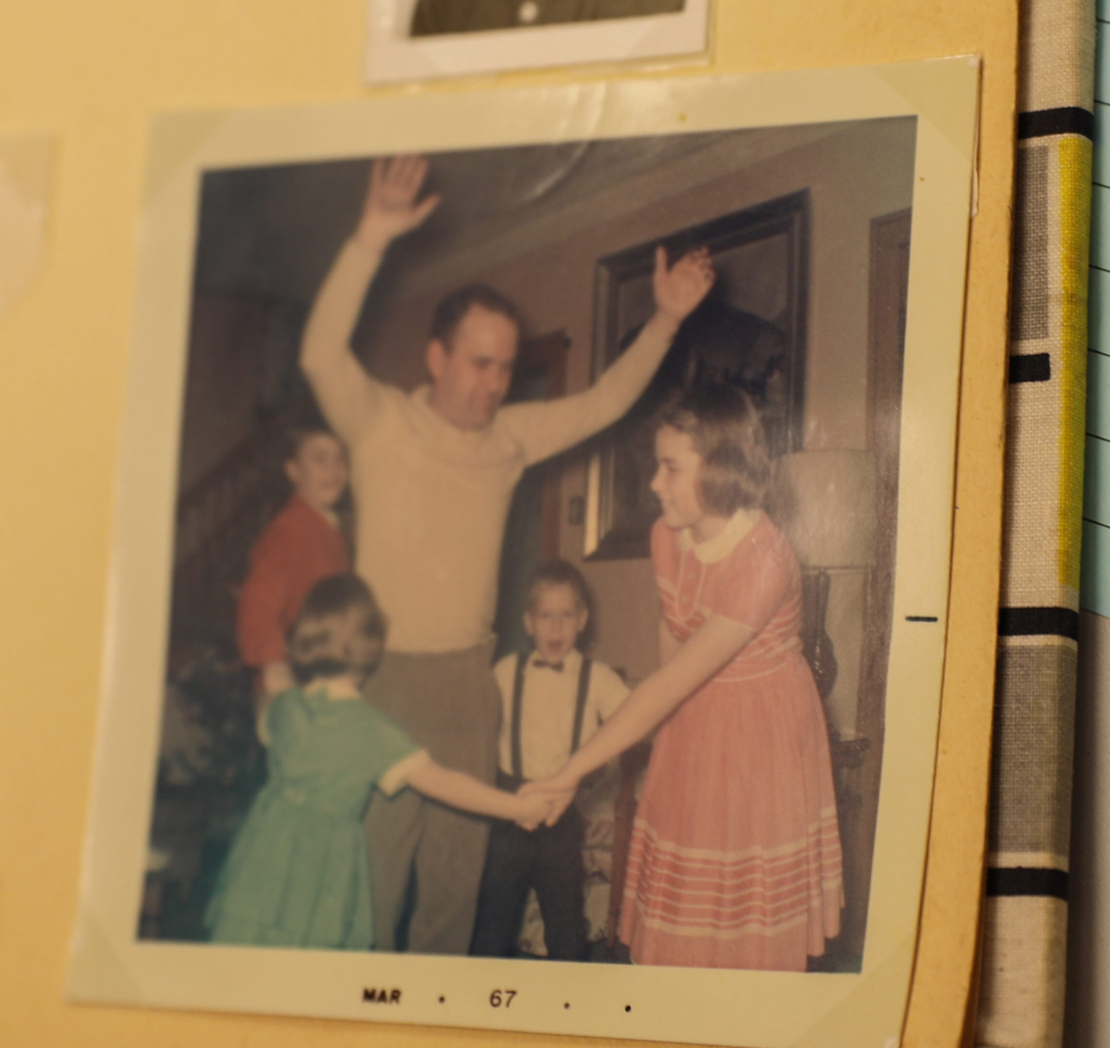The Sarosi children dance around their father, Ernest Sarosi, at their southwest Detroit home.