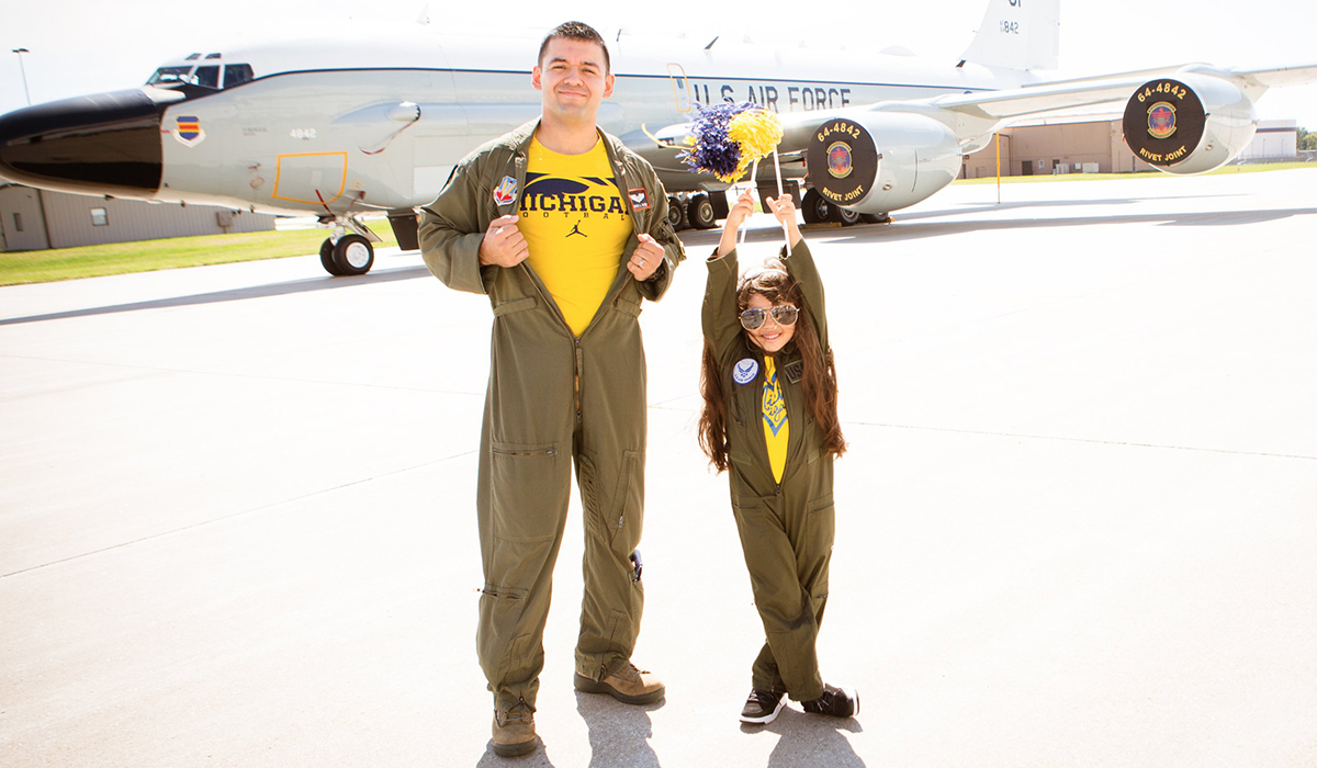 Mario A. Patino and his daughter, Naomi, pose in front of an Air Force aircraft