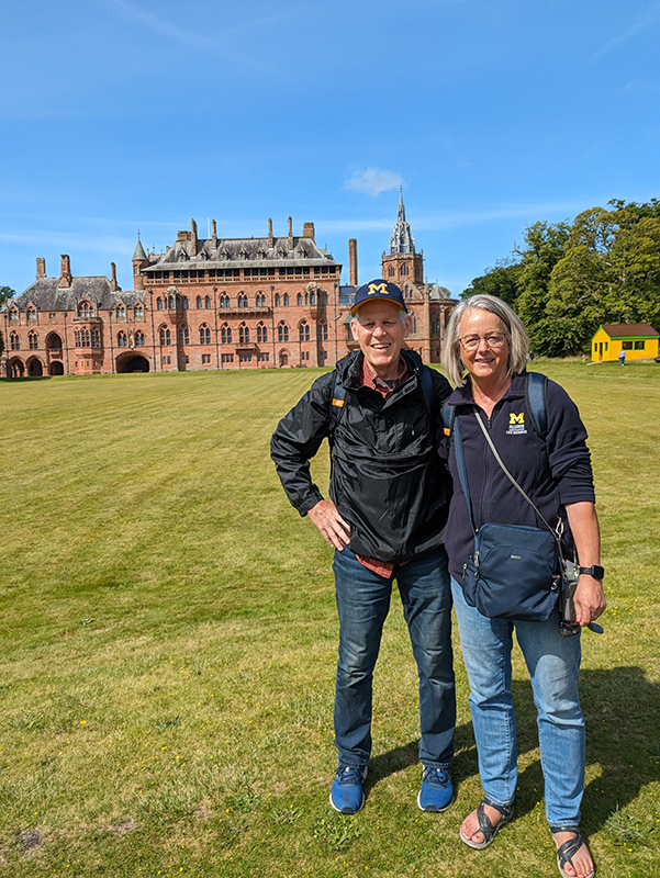 While touring Scotland over the summer of 2024, husband and wife Kenn Fillion, ’80, and Terry Brown Fillion, ’79, discovered that they were not the only Wolverines on the tour. Randy, ’71, and Andrea Young, ’70, became fast friends with the Fillions as the two couples hung out together during the tour. The Youngs were kind enough to snap this picture of Terry and Kenn in front of the Mount Stuart House on the Isle of Bute – a perfect spot for a satellite Alumni Center, by Kenn’s estimation.