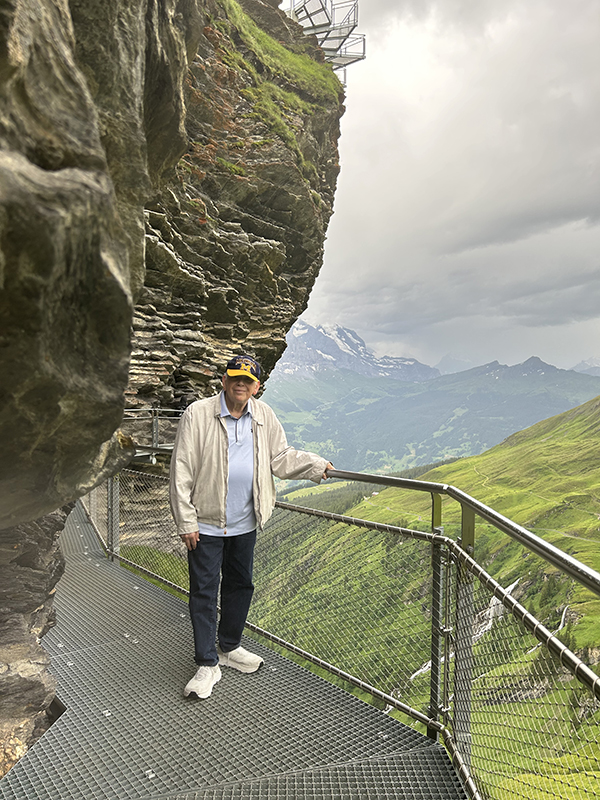 Dave Finger, ’73, MBA’76, stops to enjoy a picturesque view from the First Cliff Walk in Grindelwald, Switzerland, during a July trip.