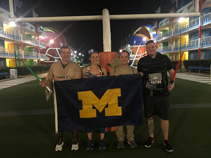 Pictured from left to right, Gary Flaishans, ’84, MSE’88, Kelsey Leichtnam, ’13, Eric Leichtnam, ’13—carrying a mentor from a galaxy far, far away—and Zachary Flaishans, ’16. The group participated in the runDisney Star Wars Rival Run 5K and the Half Marathon, held at Walt Disney World in Orlando, Florida, in April.
