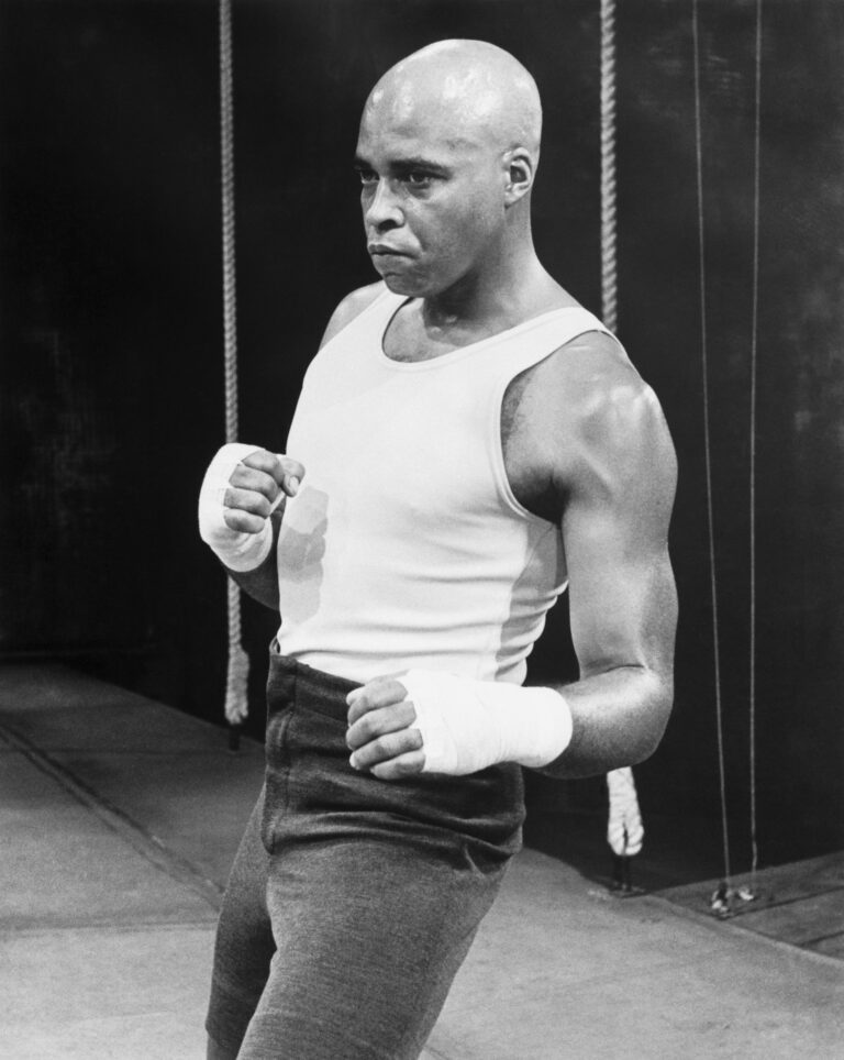 Photograph of James Earl Jones dressed In early 20th-century boxing training attire