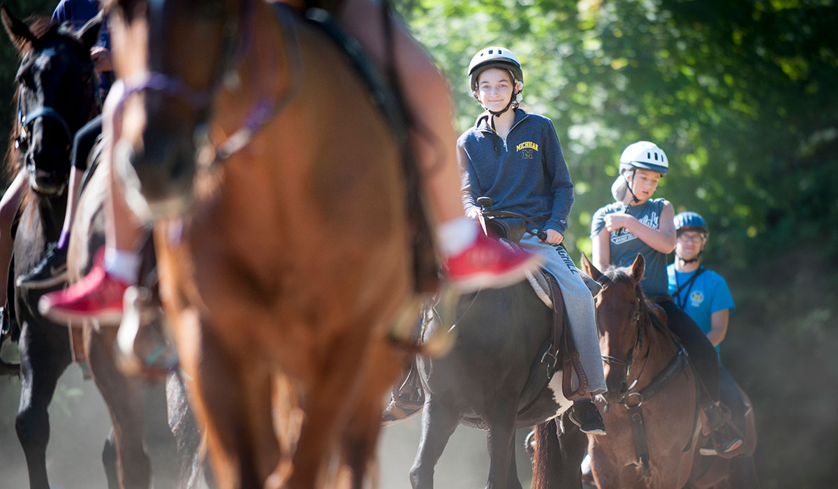 Girl Riding Horse At Camp Michigania