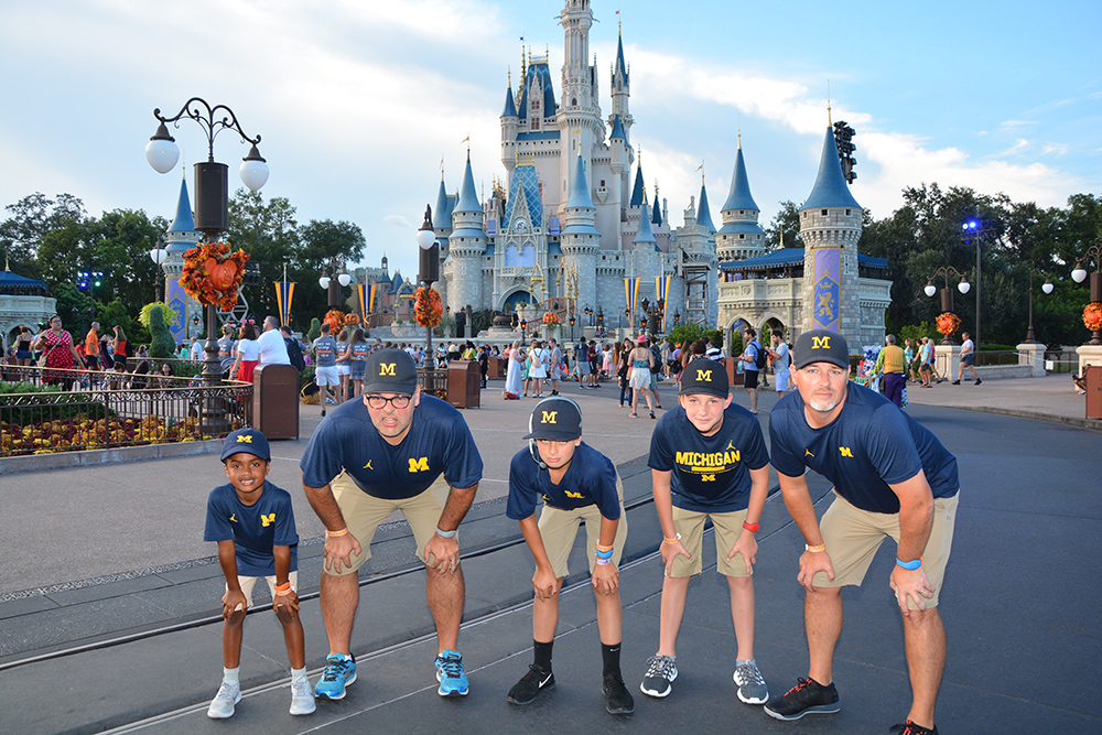 Before heading to a Halloween party at Disney World, the Graham and Pake family boys dressed like U-M head football coach Jim Harbaugh. Most amusing was seeing the reactions of fellow alumni and football fans at the park. From left to right are William Graham, Robert Graham, ’95, Robert Graham Jr., Eli Pake, and Steve Pake, ’09.