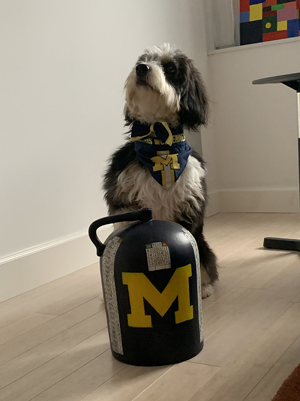 In October, Rayna Handelman, MBA’96 (behind the camera), and her dog celebrated U-M’s football victory over Minnesota in the annual “Little Brown Jug” battle.