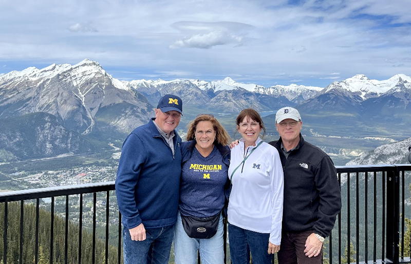 David Harwood, ’83, and his wife, Leslie, joined Larry, MD’84, and Diane Robillard, ’84, MS’93, in hailing from atop Sulphur Mountain in Banff, Alberta, Canada.