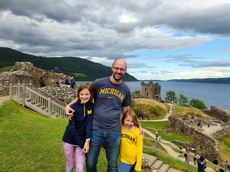 Keith Hudolin, ’06, JD’10, and his daughters, 10-year Isla and six-year-old Eleanor, showed their Michigan pride at Castle Urquhart on the banks of Loch Ness, Scotland, during a recent trip.