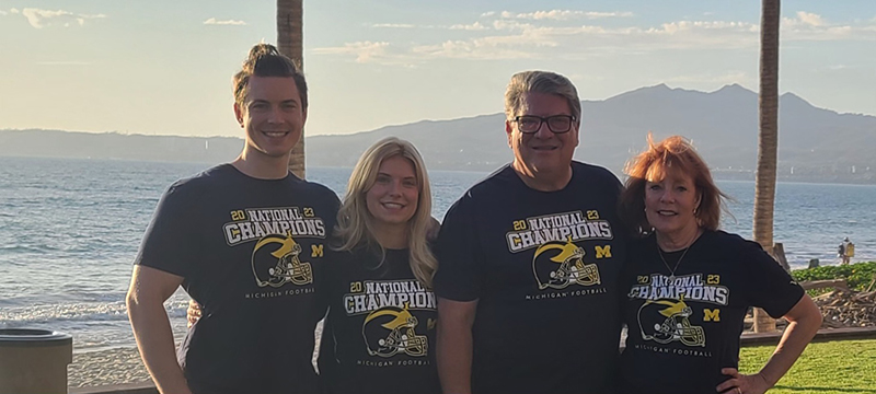 The Humenny clan celebrated the Wolverines’ College Football Championship in January while in Nuevo Vallarta, Mexico. From left to right are Will Humenny, ’21, Julia Humenny, ’19, Ron Humenny, ’74, MBA’79, and Ellen Humenny.