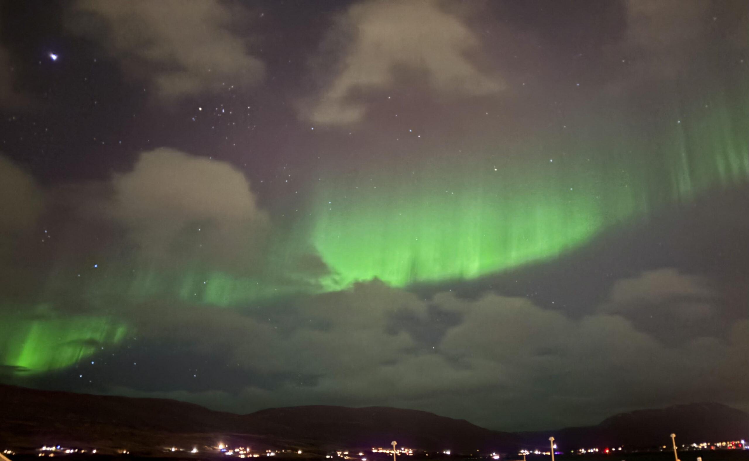 Green and purple northern lights seen above Iceland. 