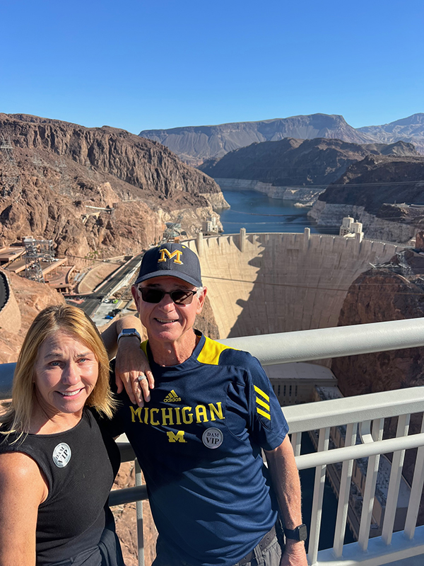 John A. Hamilton, ’72, and his wife, Lisa, visited the Nevada-side of the Hoover Dam, with the Colorado River in the background.