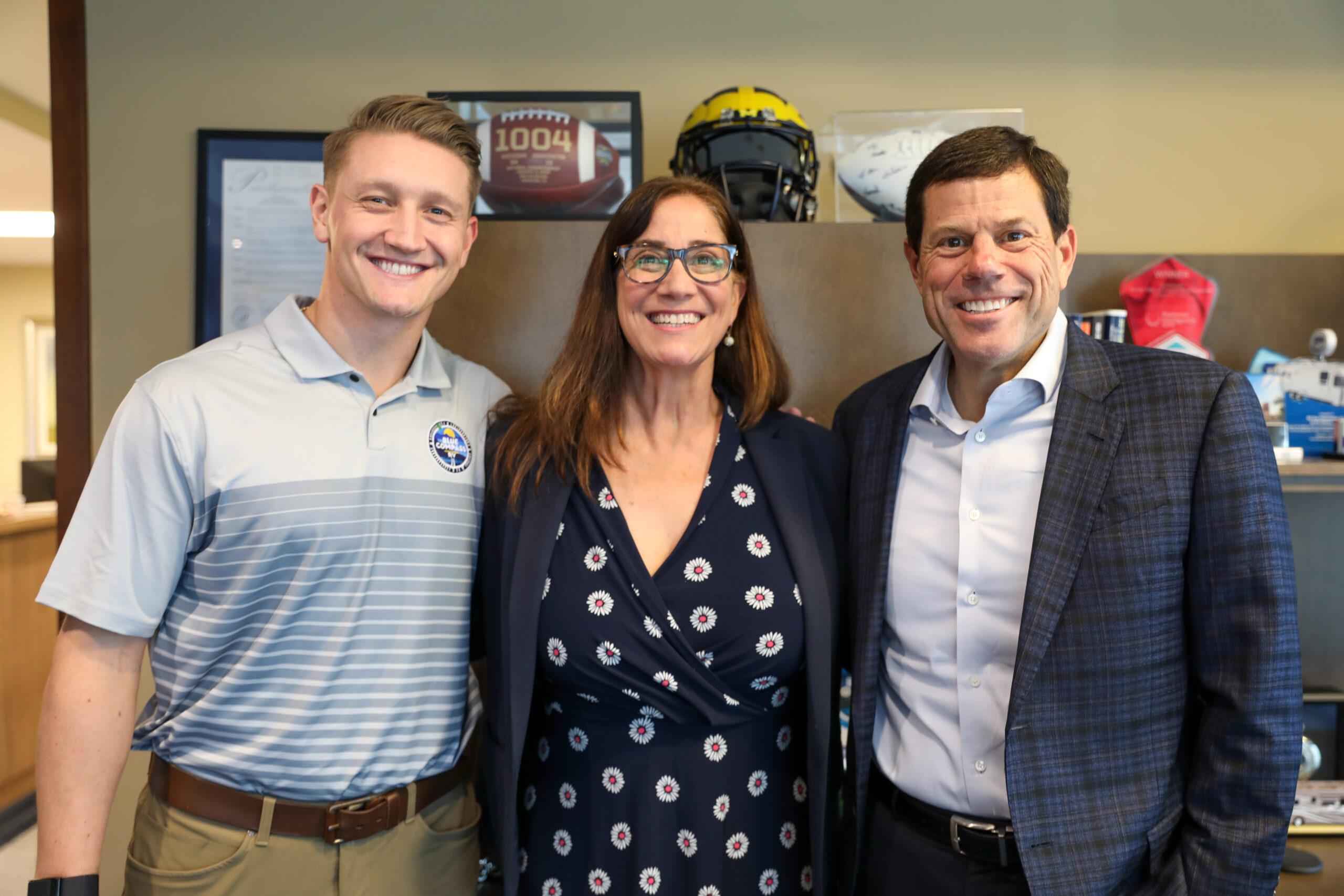 Jon Ferrando, right, poses with Jared Davis (left) and Shahnaz Broucek (center).