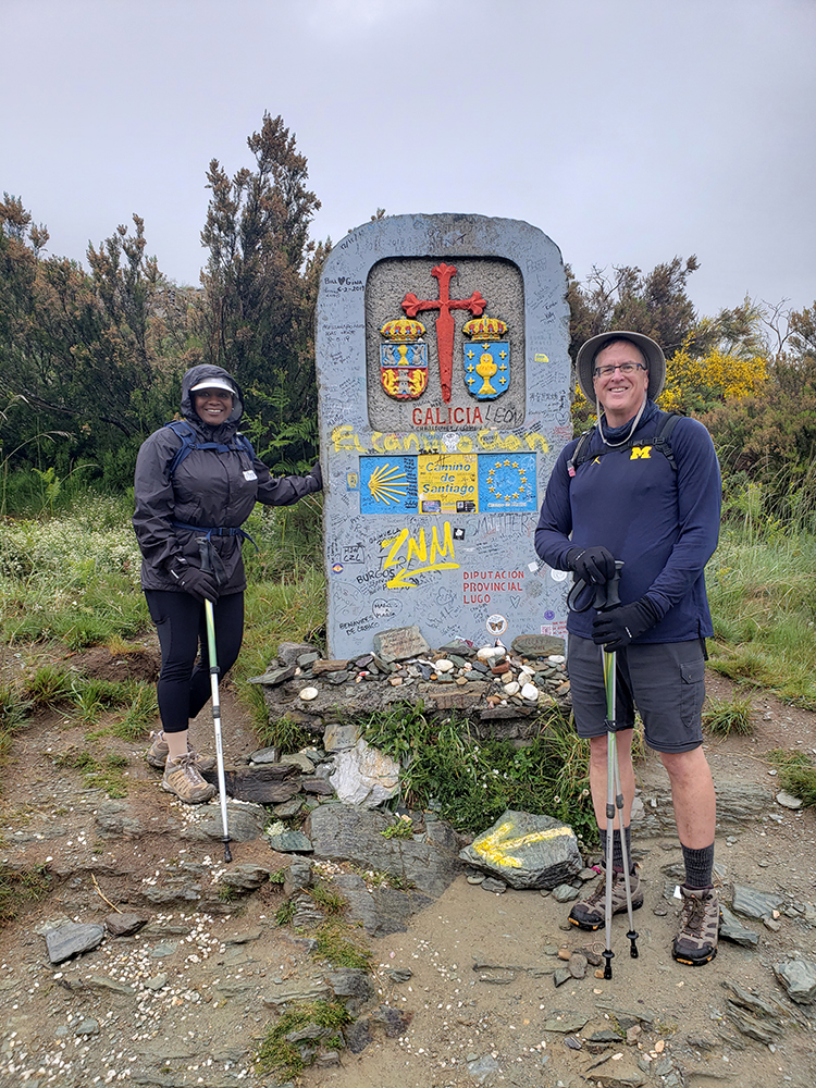 Michael Lamping, ’80, and his wife, Vernetta, stopped at a boundary marker as they trekked the ancient Camino de Santiago pilgrimage route in Spain.