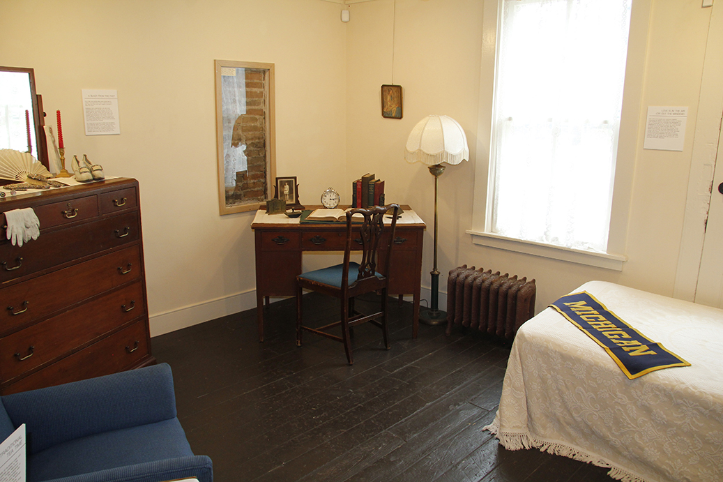 The exhibition includes a recreation of a Martha Cook Residence Hall room, circa 1917.