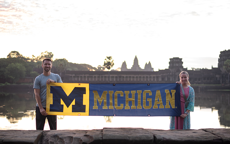 Husband and wife Alexander, ’11, and Meagan Mitchell, ’11, MSW’12, greeted the sunrise with Maize and Blue spirit at Cambodia’s Angkor Wat temple.