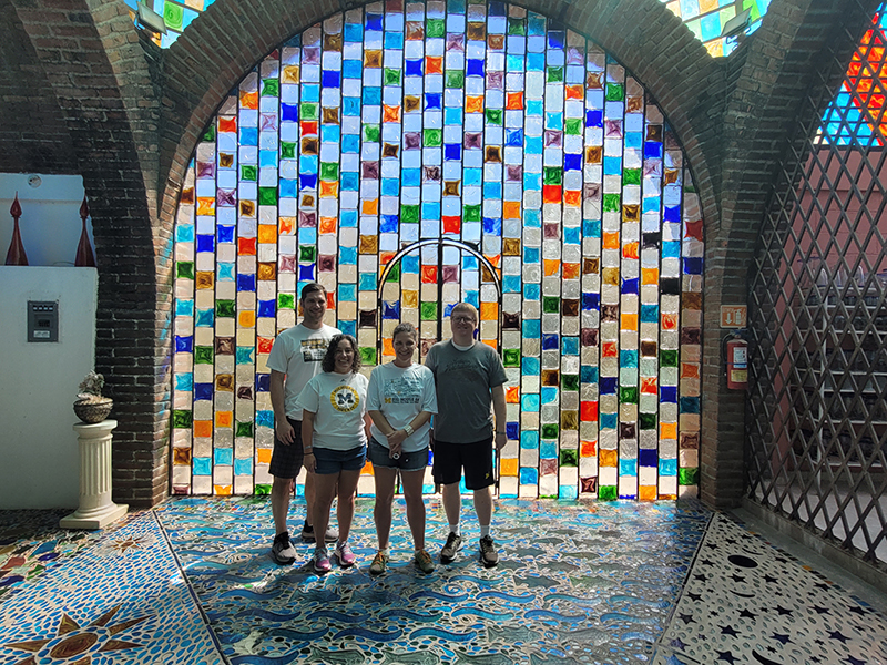 Four alums took a journey to Mexico, including a stop at the Glass Factory in Cabo San Lucas. From left to right are Jeff Mills, ’04, MSE’05; Meredith Mills, ’04; Megan Schrauben, ’02; and Ryan Schrauben, ’03.