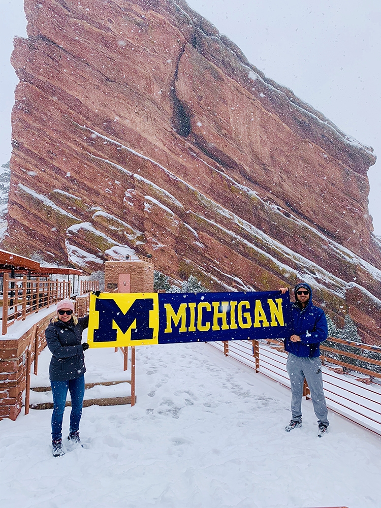 Alex, ’11, and Meagan Mitchell, ’11, MSW’12, didn’t let a little snow stop them from displaying a U-M banner at Red Rocks Amphitheater in Morrison, Colorado.