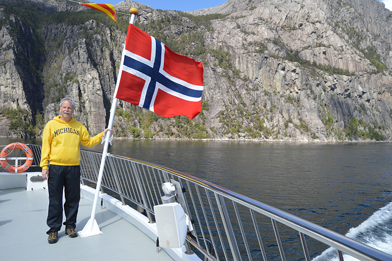 Drew Montag, ’78, MSI’04, traveled to Norway. He wore his favorite U-M sweatshirt while touring the Lysefjord, near Stavanger, home of the famous Pulpit Rock.