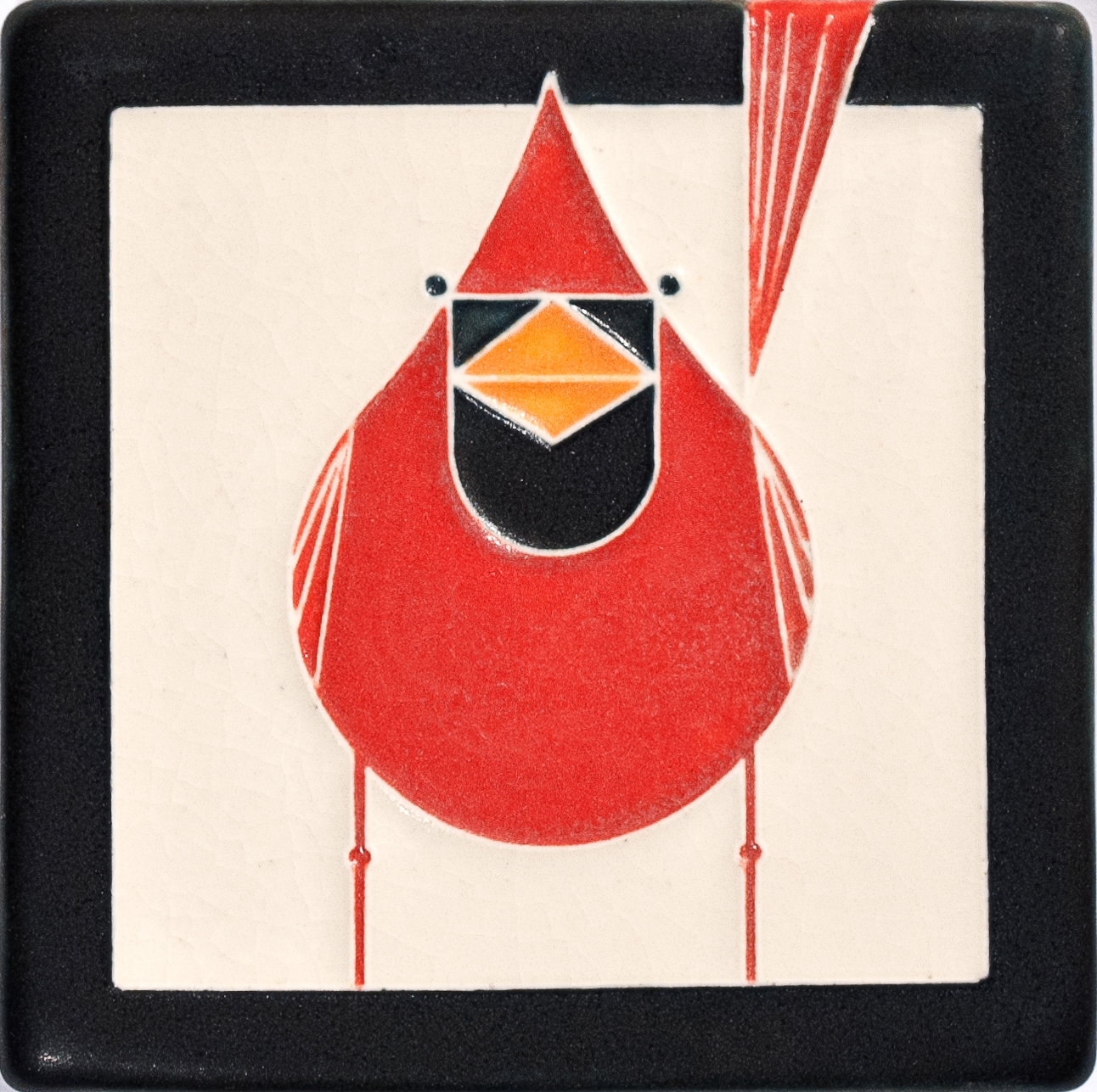 An art tile of a male cardinal designed by the American modernist artist Charley Harper from the Frank Lloyd Wright collection.