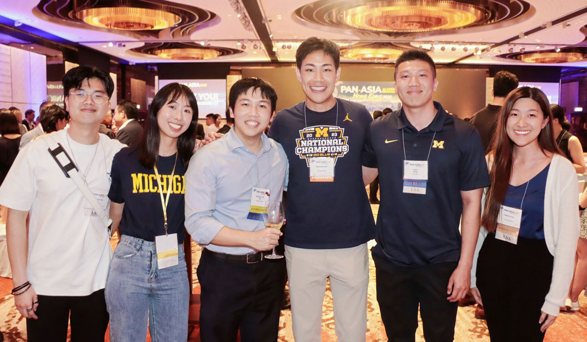 Six people pose for a photo at the 2025 Pan-Asia Alumni Reunion.