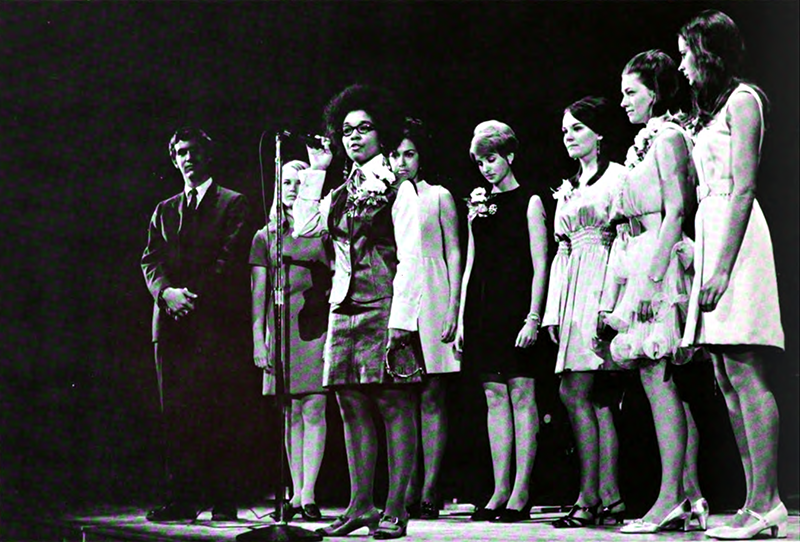 Bailey in 1968 on stage in front of the other homecoming queen contestants and ceremony host explaining the stance of herself and other Black students.