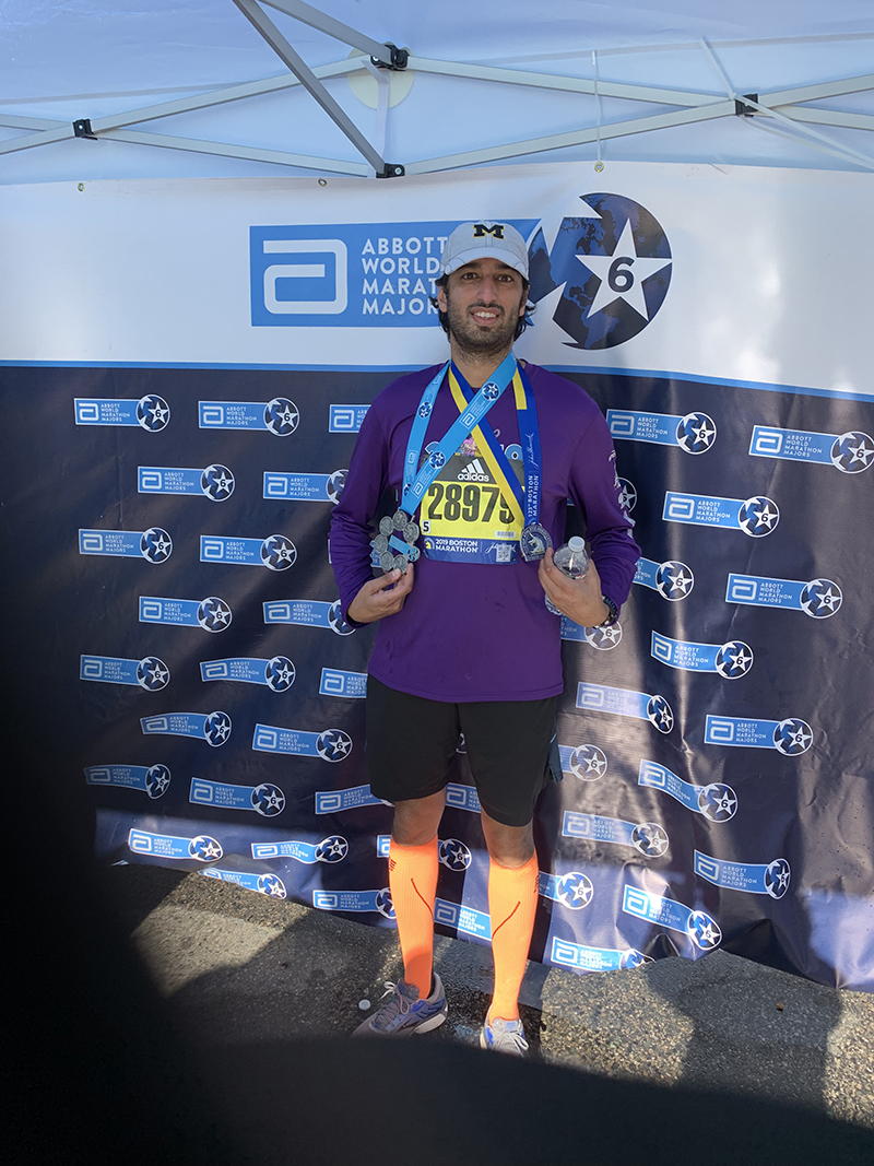 Shivam Parikh, ’05, wore his Michigan hat as he ran six major marathons across the world: New York, Tokyo, Berlin, Chicago, London, and Boston.