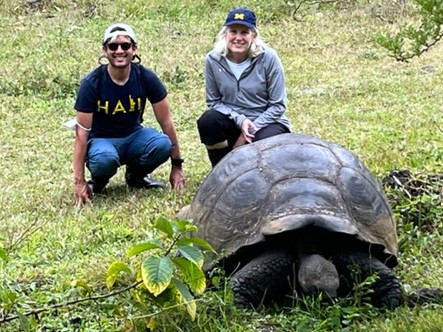 Susan Underberg Persin, ’87, met fellow alum Ben Srivastava, ’08, while visiting giant tortoises in the Galapagos isles in June.
