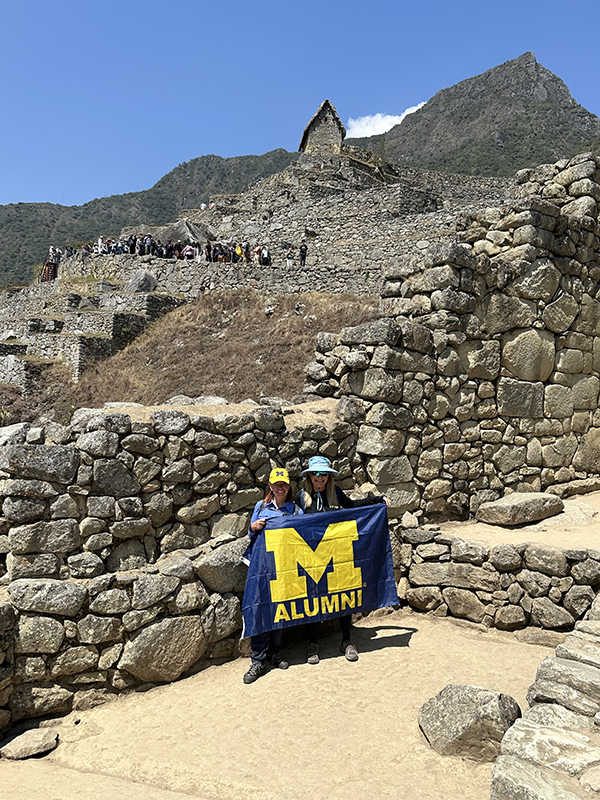 Karyn Kozo, ’82, and Aviva Pinto, ’81, “Go Blue!” from Peru’s famous Machu Picchu citadel in the Andes mountains during an August trip.