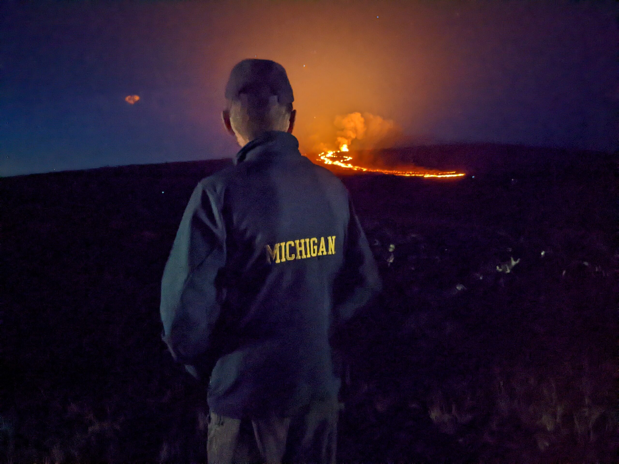 Bud Quitiquit, JD’72, observes the power of the Mauna Loa volcano as it erupts on the island of Hawaii.