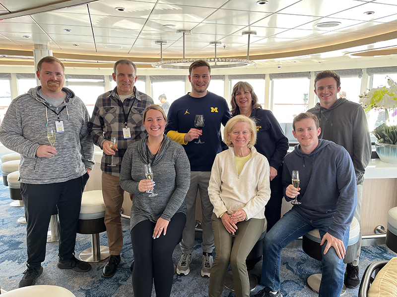 Laura Romeo, ’83, JD’86, and her son, Travis Tucker, ’22 (both in the middle of the back row), utilized Michigan Alumni Travel to meet with other alums aboard the Ocean Victory for a tour of Antarctica in January 2023.