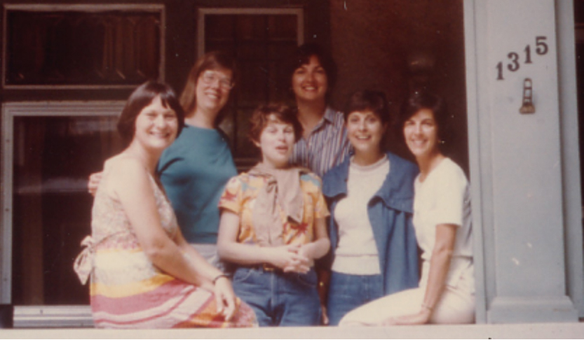 A photo from the 1960s of "the roomies" posing together on a front porch with the address numbers 1315 on the right.