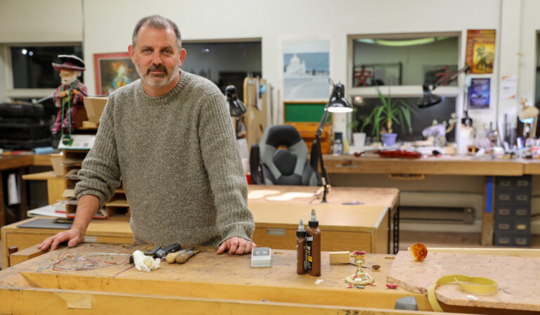 Luthier Ryan Bodiford in his studio at Shar Music in Ann Arbor.