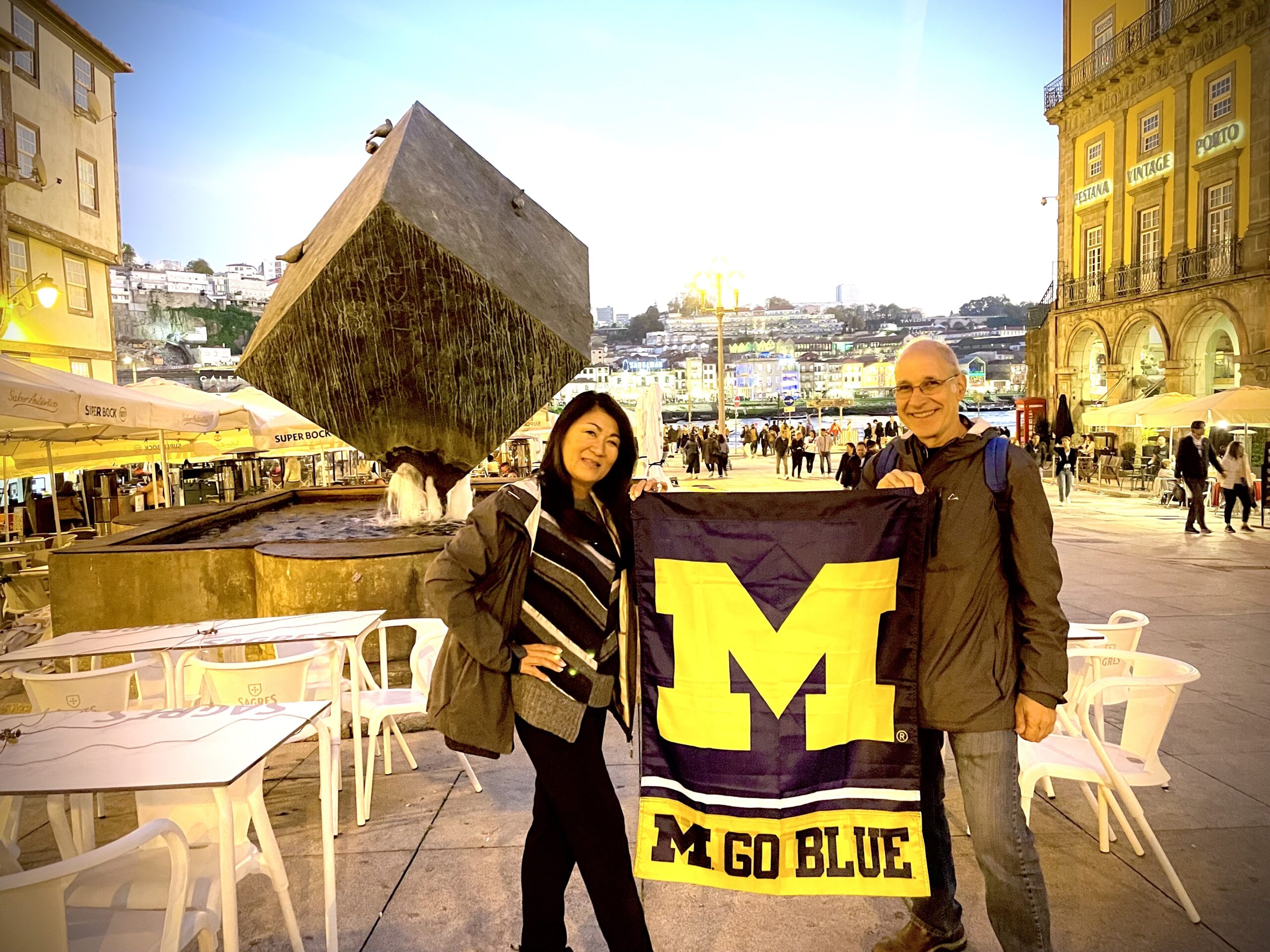 On a November 2022 trip to Porto, Portugal, Alysa Watanabe Sakkas, ’85, and Kosta Sakkas, ’84, spotted what looked like Ann Arbor's “The Cube” sculpture just outside their hotel at Praca da Ribeira. They knew they had to take a photo.